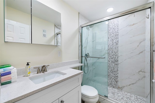 6025 Shore Blvd S Unit 409, Gulfport, FL 33707 - bathroom featuring a marble finish shower, vanity, toilet, and recessed lighting