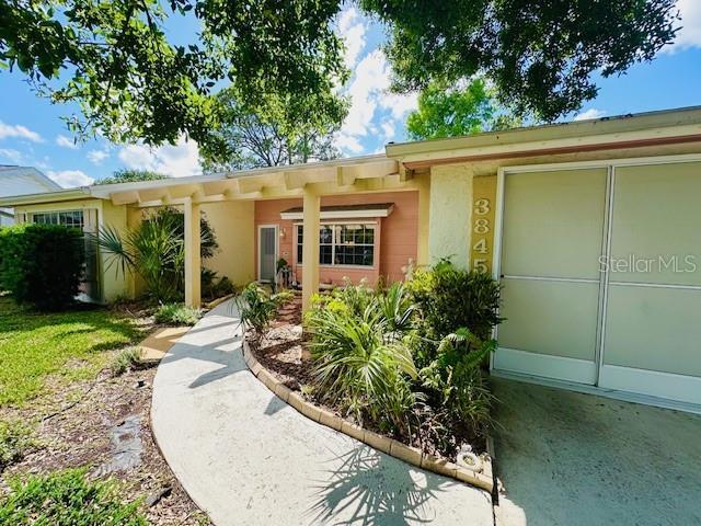 single story home featuring stucco siding