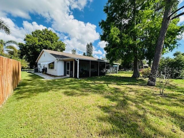rear view of property with a sunroom