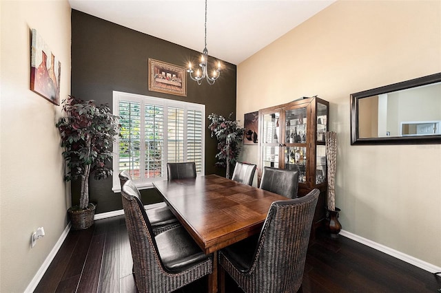 14042 Marlberry Way, Odessa, FL 33556 - dining area with baseboards, hardwood / wood-style floors, a chandelier, and a high ceiling