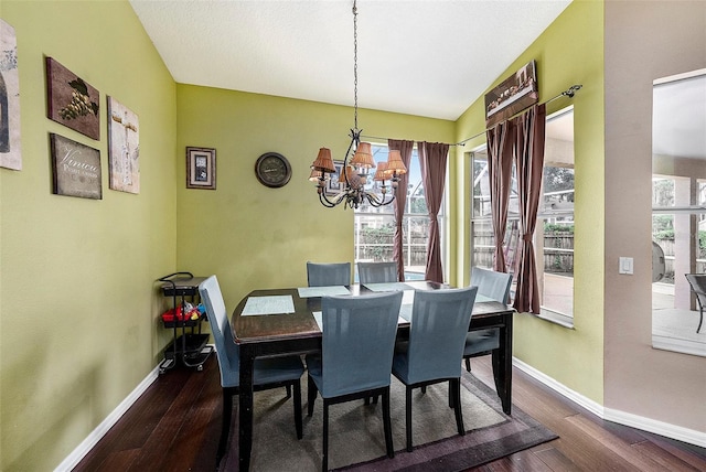 14042 Marlberry Way, Odessa, FL 33556 - dining room with a chandelier, dark wood-type flooring, and baseboards