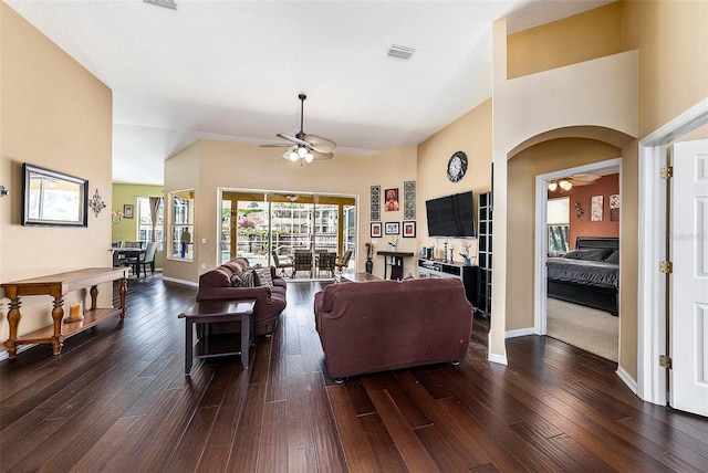 14042 Marlberry Way, Odessa, FL 33556 - living room featuring a ceiling fan, hardwood / wood-style floors, baseboards, and arched walkways