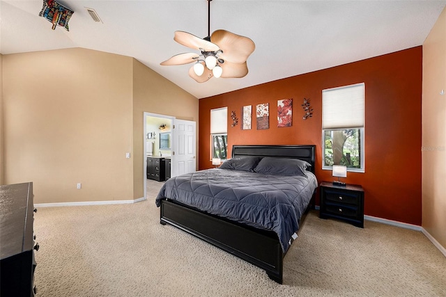 14042 Marlberry Way, Odessa, FL 33556 - carpeted bedroom with vaulted ceiling, baseboards, a ceiling fan, and ensuite bath
