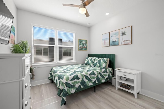 bedroom featuring baseboards, light wood-type flooring, ceiling fan, and recessed lighting
