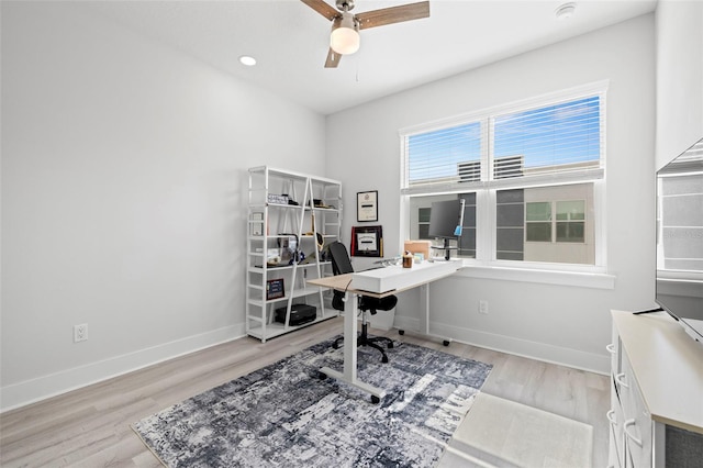 office with ceiling fan, light wood-style flooring, and baseboards