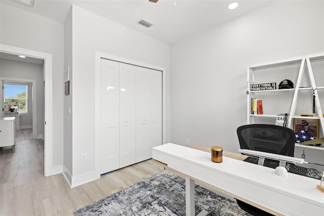 home office featuring light wood-style floors, baseboards, and recessed lighting