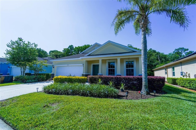 view of front of property with a front yard, a garage, driveway, and covered porch