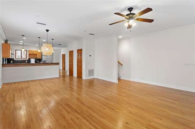512 S Glen Ave, Tampa, FL 33609 - unfurnished living room with light wood-type flooring, crown molding, recessed lighting, stairs, and ceiling fan