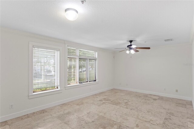 512 S Glen Ave, Tampa, FL 33609 - spare room with ornamental molding, plenty of natural light, ceiling fan, and baseboards