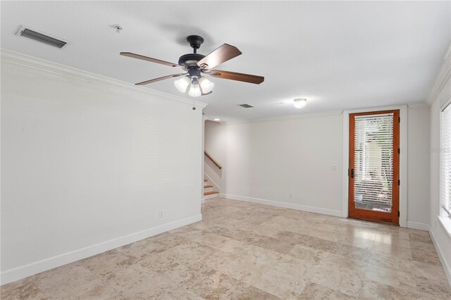 512 S Glen Ave, Tampa, FL 33609 - empty room featuring crown molding, stairs, ceiling fan, baseboards, and a pendent fire sprinkler