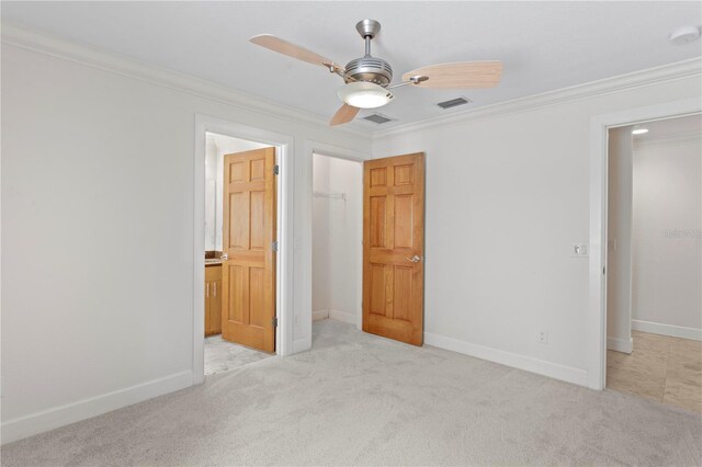 512 S Glen Ave, Tampa, FL 33609 - unfurnished bedroom featuring crown molding, carpet, baseboards, a closet, and ceiling fan