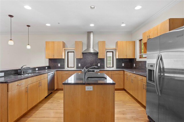512 S Glen Ave, Tampa, FL 33609 - kitchen featuring stainless steel appliances, wall chimney range hood, ornamental molding, a sink, and a peninsula