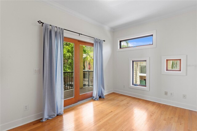 512 S Glen Ave, Tampa, FL 33609 - spare room featuring crown molding, baseboards, and wood finished floors