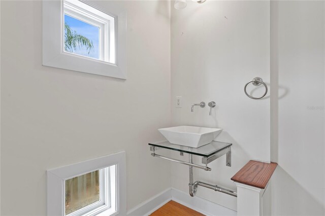 512 S Glen Ave, Tampa, FL 33609 - bathroom with a sink, baseboards, and wood finished floors