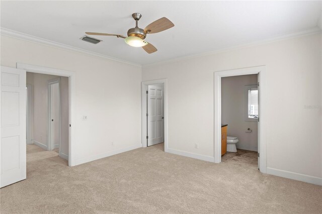 512 S Glen Ave, Tampa, FL 33609 - unfurnished bedroom with ornamental molding, light colored carpet, baseboards, connected bathroom, and ceiling fan