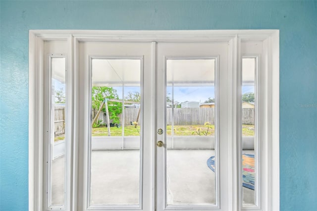 8528 Iris Ave, Seminole, FL 33777 - doorway with a textured wall and french doors