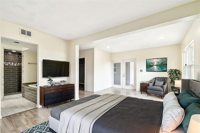 8528 Iris Ave, Seminole, FL 33777 - bedroom featuring light wood-type flooring, french doors, and recessed lighting