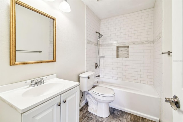 8528 Iris Ave, Seminole, FL 33777 - full bathroom with wood finished floors, toilet, vanity, and washtub / shower combination