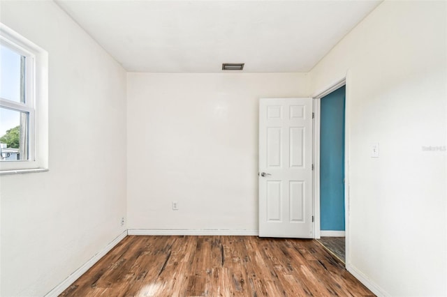 8528 Iris Ave, Seminole, FL 33777 - empty room with wood finished floors and baseboards