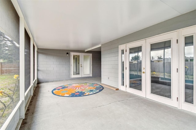 8528 Iris Ave, Seminole, FL 33777 - unfurnished sunroom featuring french doors