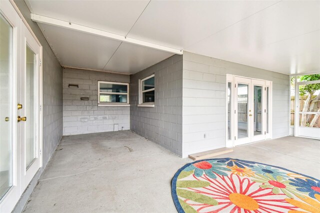 8528 Iris Ave, Seminole, FL 33777 - unfurnished sunroom with french doors