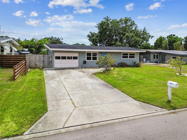 8528 Iris Ave, Seminole, FL 33777 - ranch-style home with a garage and driveway