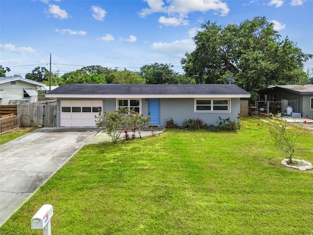 8528 Iris Ave, Seminole, FL 33777 - ranch-style house with concrete driveway and a garage
