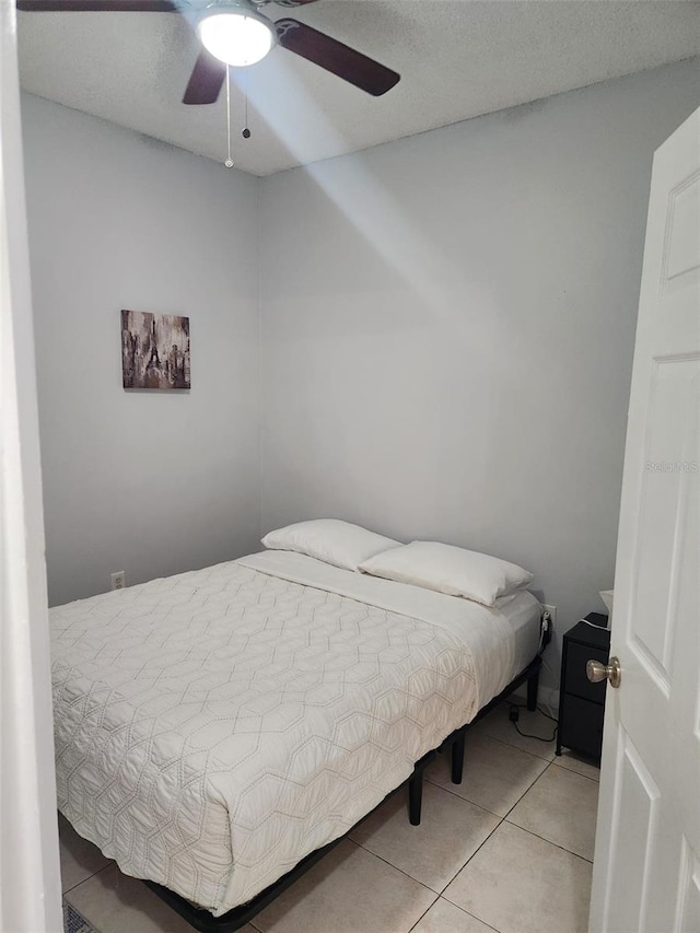 13140 Summerton Dr, Orlando, FL 32824 - bedroom featuring light tile patterned floors and a ceiling fan