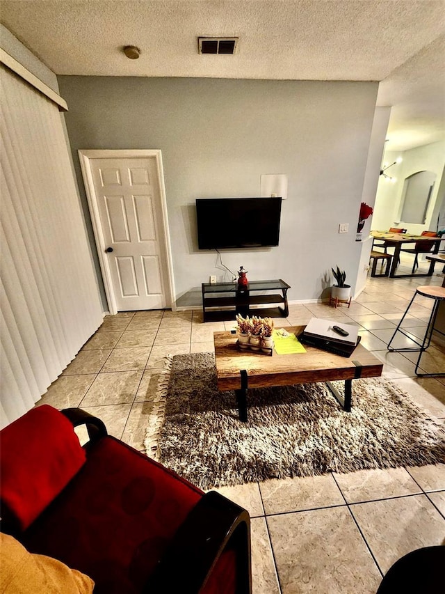 13140 Summerton Dr, Orlando, FL 32824 - tiled living area featuring a textured ceiling