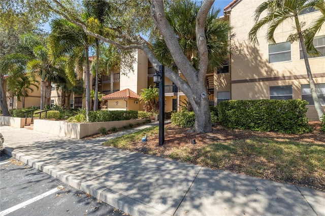 view of property with uncovered parking