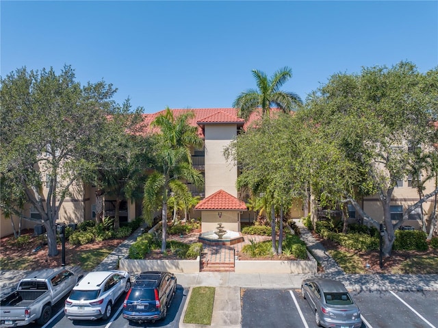 view of property with uncovered parking