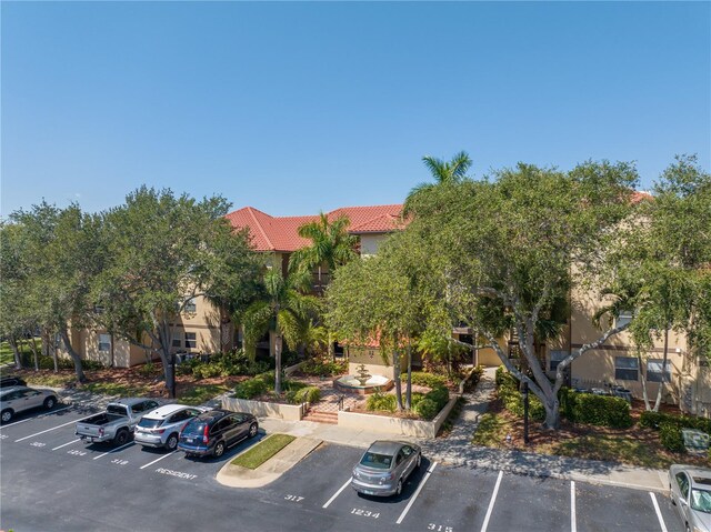 view of property featuring uncovered parking