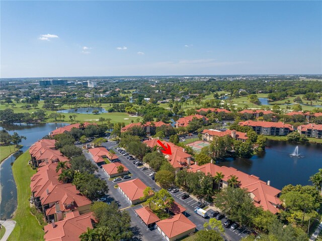 aerial view of residential area with a large body of water and a golf club
