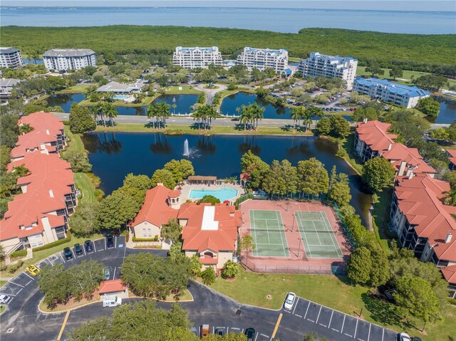 bird's eye view of a large body of water and apartment complex / building