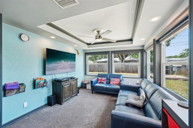 1450 Seabreeze St, Clearwater, FL 33756 - carpeted living area featuring a tray ceiling, a ceiling fan, and baseboards