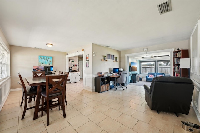 1450 Seabreeze St, Clearwater, FL 33756 - dining area with light tile patterned floors, an office area, a ceiling fan, and baseboards