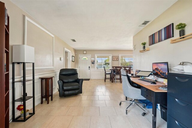1450 Seabreeze St, Clearwater, FL 33756 - office featuring light tile patterned flooring and a decorative wall