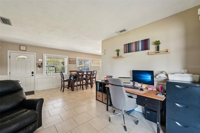 1450 Seabreeze St, Clearwater, FL 33756 - office space with wainscoting, light tile patterned floors, and a decorative wall
