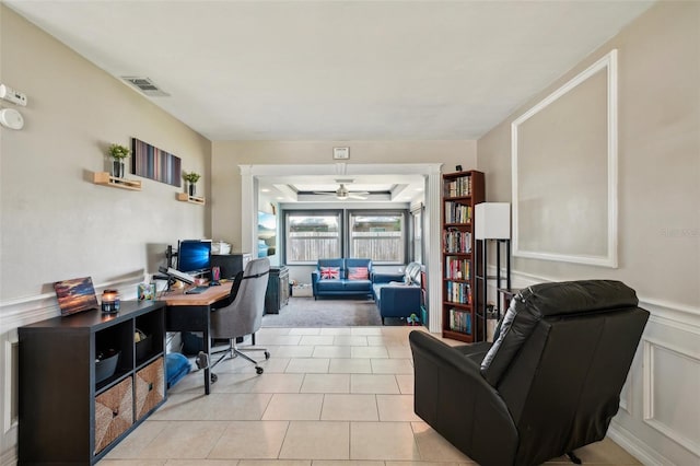 1450 Seabreeze St, Clearwater, FL 33756 - office area with a ceiling fan, a decorative wall, a wainscoted wall, and light tile patterned flooring