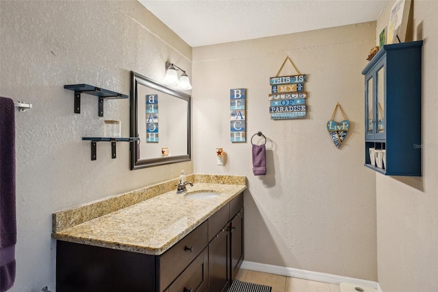 1450 Seabreeze St, Clearwater, FL 33756 - bathroom with vanity, tile patterned flooring, and baseboards
