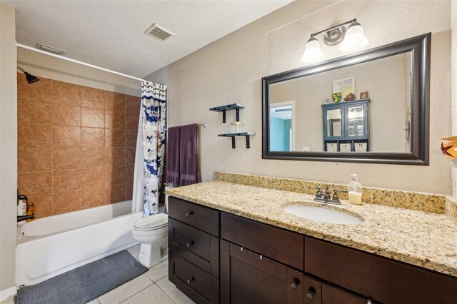 1450 Seabreeze St, Clearwater, FL 33756 - bathroom with vanity, tile patterned floors, toilet, and shower / bathtub combination with curtain