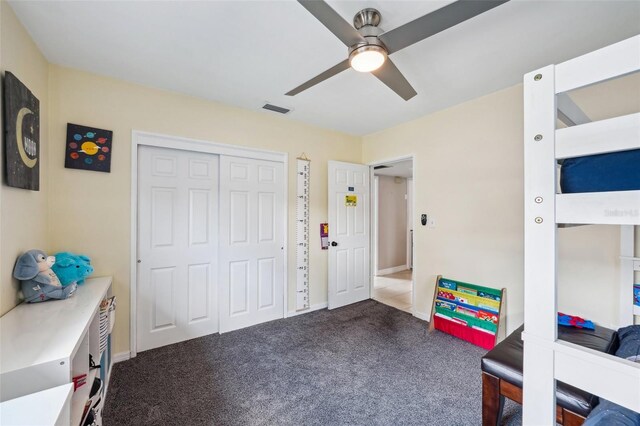 1450 Seabreeze St, Clearwater, FL 33756 - carpeted bedroom featuring a closet and a ceiling fan