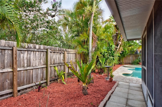 1955 Cobblestone Way, Clearwater, FL 33760 - fenced backyard with a patio