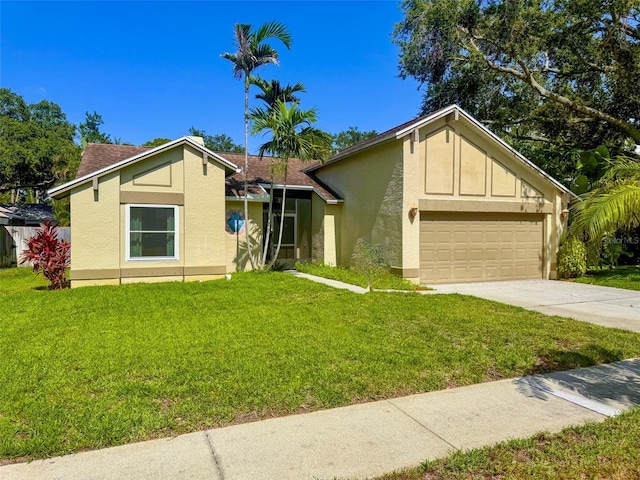 1955 Cobblestone Way, Clearwater, FL 33760 - mid-century modern home with stucco siding, driveway, a front lawn, and a garage
