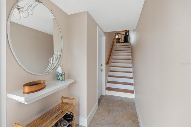 12360 Capri Cir N Unit 106, Treasure Island, FL 33706 - stairs with baseboards