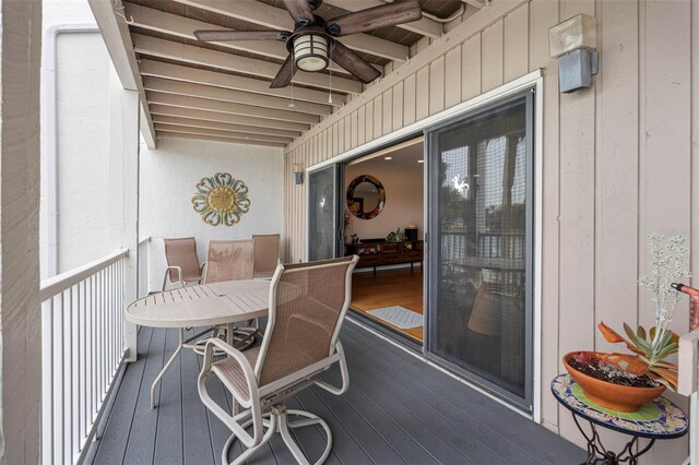12360 Capri Cir N Unit 106, Treasure Island, FL 33706 - deck featuring a ceiling fan and outdoor dining space