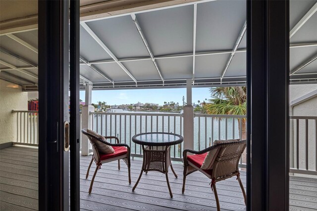 12360 Capri Cir N Unit 106, Treasure Island, FL 33706 - wooden terrace featuring a water view