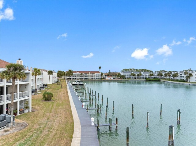 12360 Capri Cir N Unit 106, Treasure Island, FL 33706 - dock area with a water view, a residential view, and a yard