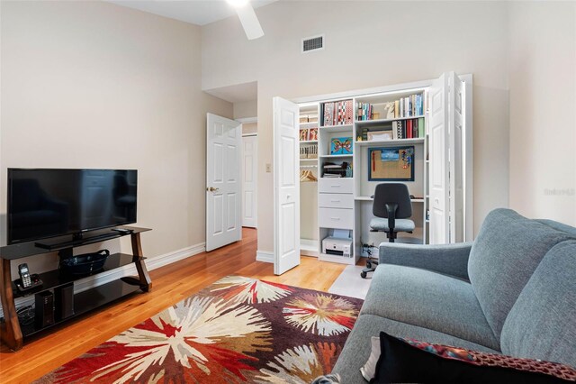 12360 Capri Cir N Unit 106, Treasure Island, FL 33706 - office area with wood finished floors, ceiling fan, and baseboards
