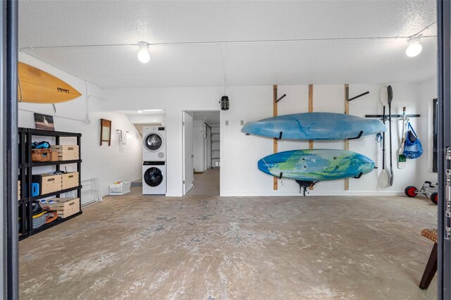 12360 Capri Cir N Unit 106, Treasure Island, FL 33706 - dining space featuring stacked washer / drying machine and concrete floors